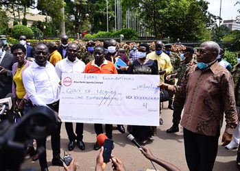 Photos: Businessman Ham Donates shs.100m towards COVID-19 Response Fund