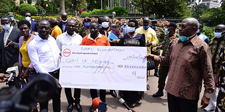 Photos: Businessman Ham Donates shs.100m towards COVID-19 Response Fund