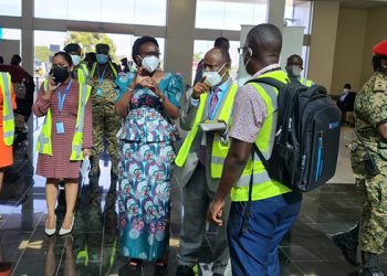 Minister Aceng rushes to Entebbe Airport over Mandatory Covid-19 testing ‘Confusion’